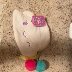 Brand new, never used it unicorn pouch Dream in color.